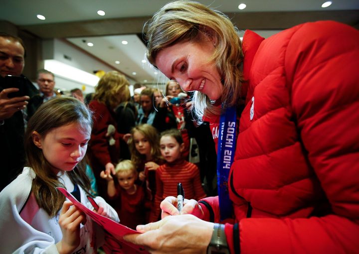 Hayley Wickenheiser signs autographs after returning from the 2014 Sochi Olympics.