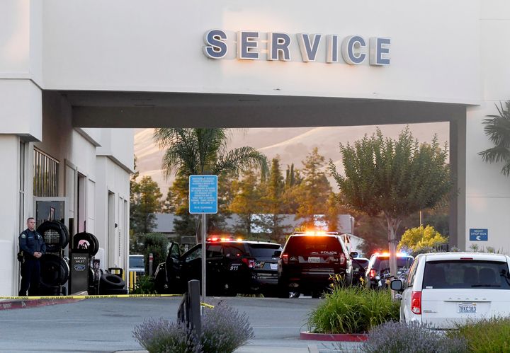 Police investigate at the scene of a shooting at the Morgan Hill Ford Store in Morgan Hill, Calif., on Tuesday.
