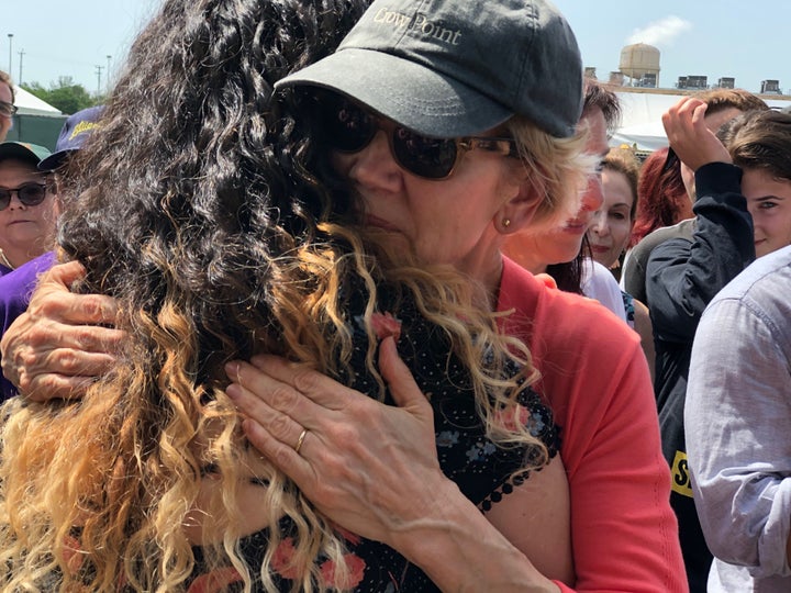 Sen. Elizabeth Warren hugs a crying demonstrator outside the Homestead detention center in Florida on Monday, June 26, 2019.