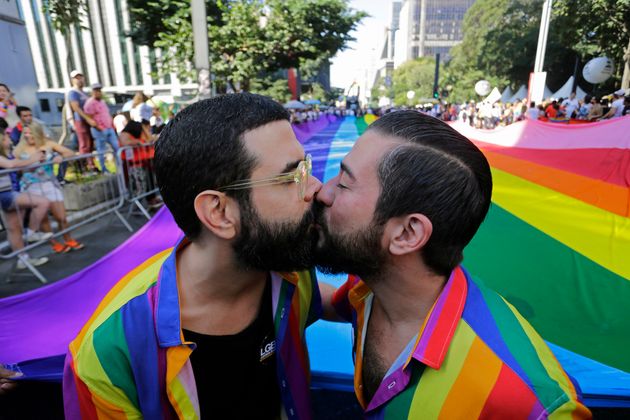 Two partners kiss during the Pride parade in São Paulo, which acted as a 