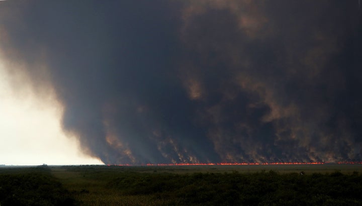 Smoke from a wildfire scorching tens of thousands of acres of the Everglades this week.