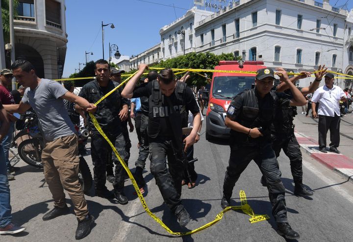 Tunisian police work at the site of an attack in the Tunisian capital's main avenue Habib Bourguiba 