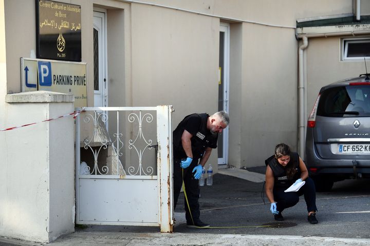 Police officers investigate the site of a shooting incident that left two people injured on June 27, 2019, at the Pontanezen Sunna mosque in Brest, western France.