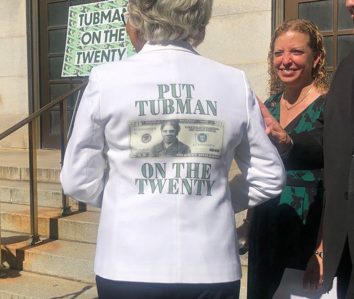Rep. Joyce Beatty (D-Ohio) turns around to display the back of her suit jacket that says: "Put Tubman On The Twenty" with a mock-up of the Tubman $20 Bill in the center.
