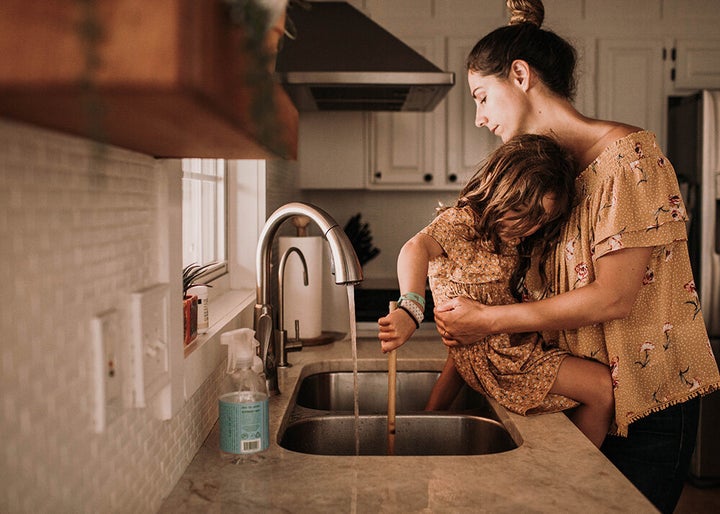 The author started taking self-portraits with her children after realizing an important element was missing in the albums she made for them -- their mother.