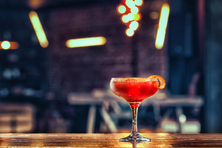 Negroni coctail standing on the table close up