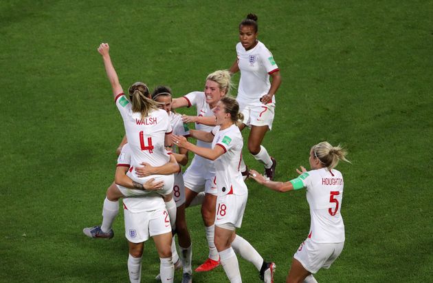 Lucy Bronze celebrates scoring England's third goal.