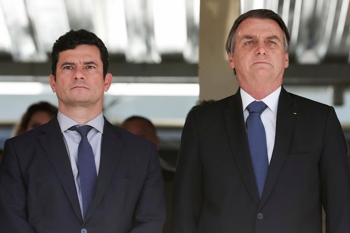 In this photo released by Brazil's Presidential Press Office, President Jair Bolsonaro, right, and Justice Minister Sergio Moro attend a military ceremony in Brasilia on June 11.