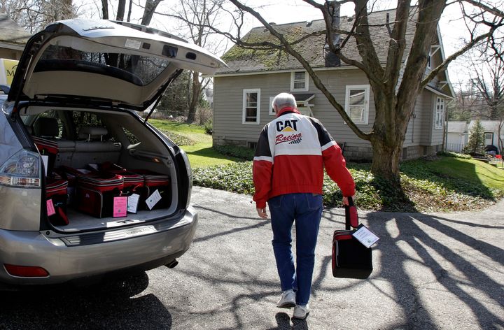 A Meals on Wheels volunteer delivers food to an elderly resident in Chagrin Falls, Ohio.