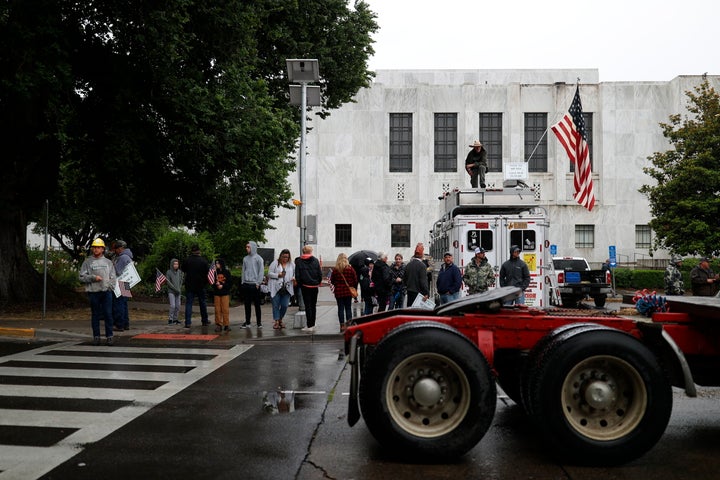 Truckers and loggers opposed to the carbon capping bill hold a rally at the Oregon Capitol on Thursday morning.