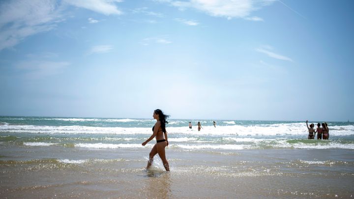 23-year-old Lucia enjoys the cool sea water in the sunshine on the beach in Bournemouth, Dorset as temperatures are set to rise over the weekend. 