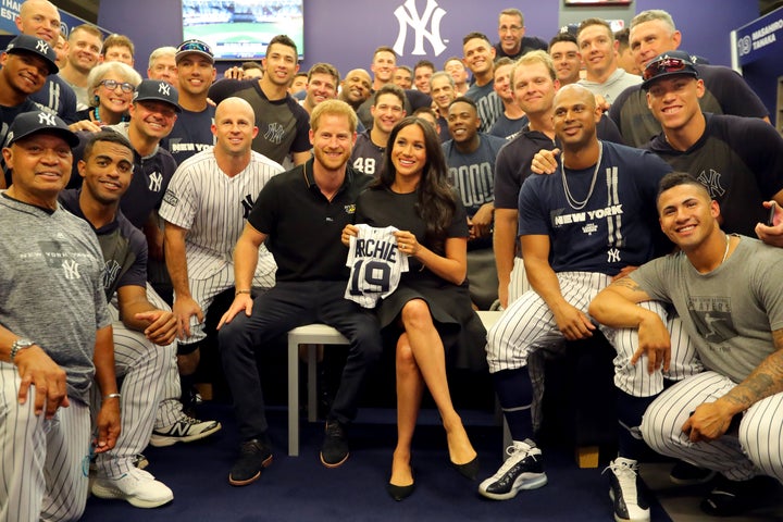 The Duke and Duchess of Sussex pose for a photo with the New York Yankees in the clubhouse prior to the first game of the London series.