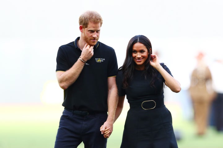 Harry and Meghan look on during the pre-game ceremonies before the MLB London game between the Boston Red Sox and the New York Yankees.