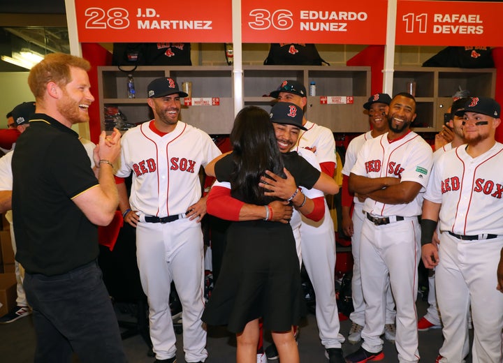 Meghan Markle hugs Mookie Betts at the Yankes-Red Sox game in London on Saturday.