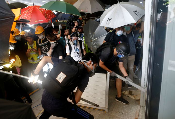 Protestors breaking into the Legislative Council building.