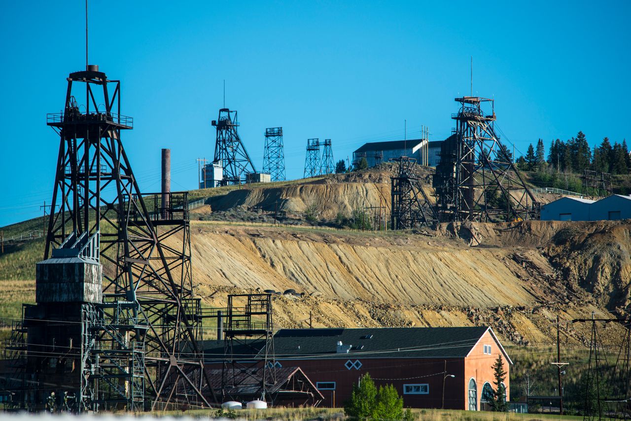 Old copper mine shaft headframes on a hill above Butte, Montana.