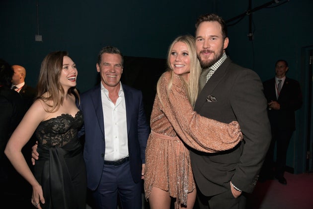 Gwyneth Paltrow hugs Chris Pratt as Elizabeth Olsen and Josh Brolin look on at the “Avengers: Infinity...