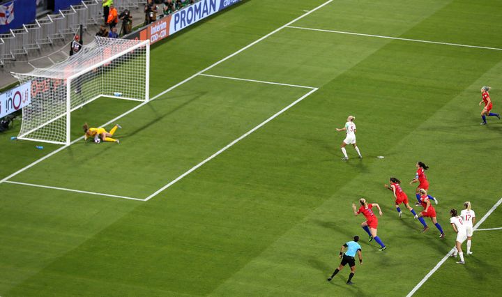 England's Steph Houghton sees her penalty saved by USA goalkeeper Alyssa Naeher.