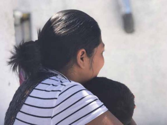 “Carmen S.” holds her son, 3, at a shelter where they were staying in Ciudad Juárez, Mexico, in May after being returned to Mexico under the Trump administration’s policy. Carmen told Human Rights Watch that she was thinking of trying to cross illegally but was afraid of losing her children.