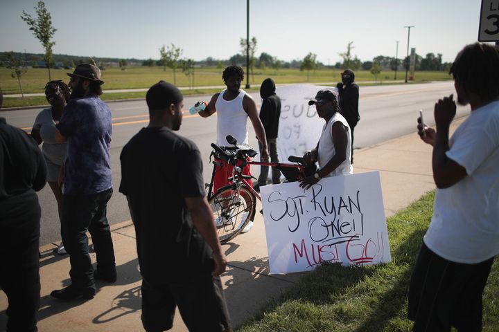 Demonstrators protest the shooting death of Eric Logan outside of the South Bend Police Station following his funeral on June 29, 2019, in South Bend, Indiana.