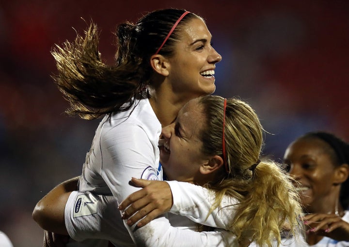 Alex Morgan and Lindsey Horan celebrate at a match against Canada during the CONCACAF Women's Championship final match on October 17, 2018, in Frisco, Texas.