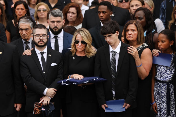 Lainie Alvarez stands after the funeral for former NYPD detective Luis Alvarez, a former New York City police detective who w