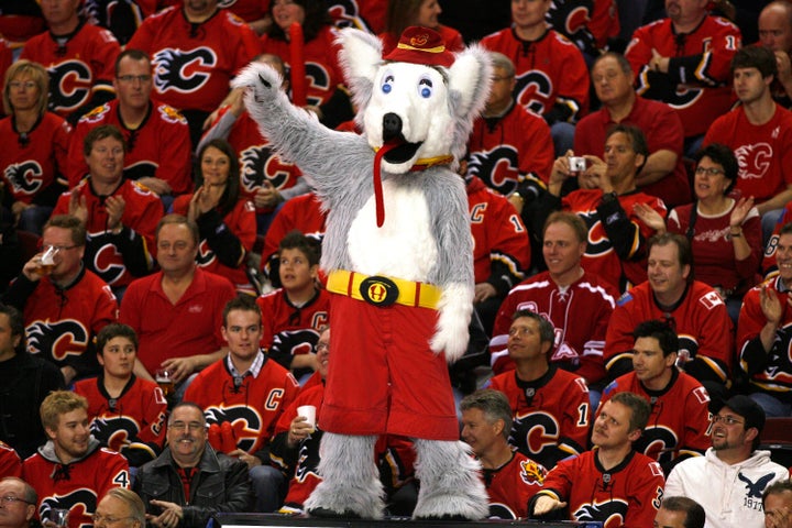 Harvey the Hound pictured with Calgary Flames fans. 