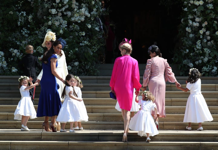 Jessica Mulroney, in blue on the left, leads her daughter Ivy at Meghan Markle and Prince Harry's wedding at Windsor Castle on May 19, 2018.