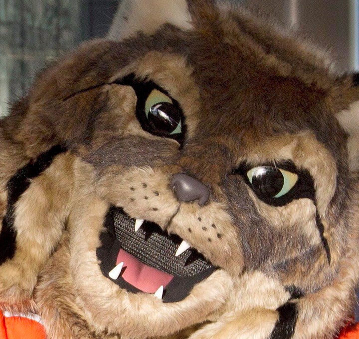 Hunter, the Edmonton Oilers' mascot, poses with fans. 