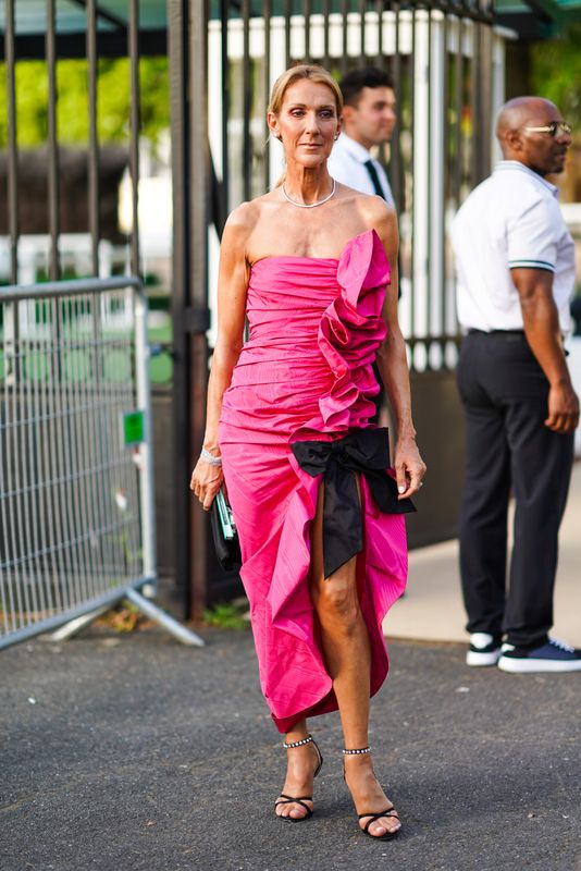 Here she is in a more exaggerated but infinitely more stylish version of my actual prom dress, outside Miu Miu Club 2020. Yes, it's campy, but her styling and accessories are also restrained &mdash; she knows exactly what she's doing.&nbsp;