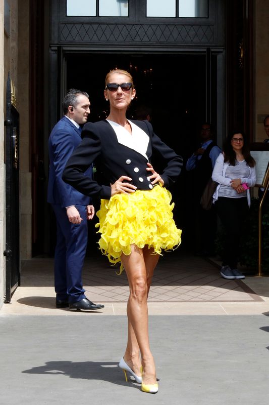 Shoulders back, legs outstretched, frilly yellow miniskirt on display. If only we could all live life with such confidence!