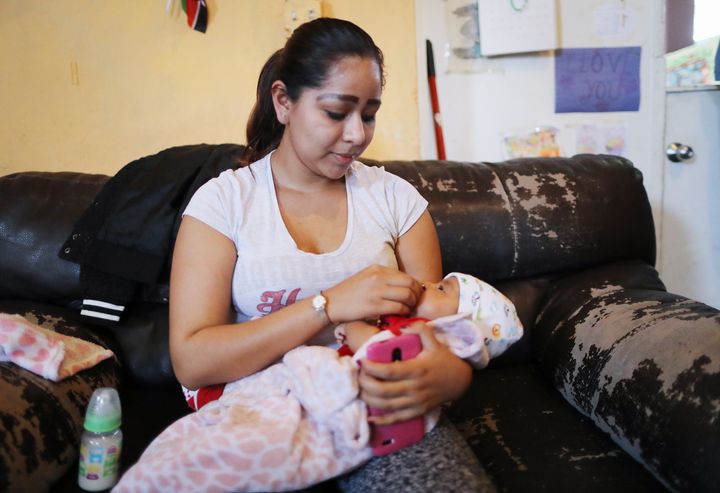 A Central American migrant mother cares for her baby at an Annunciation House facility, a Catholic charity for migrants, on May 15, 2019 in El Paso, Texas.