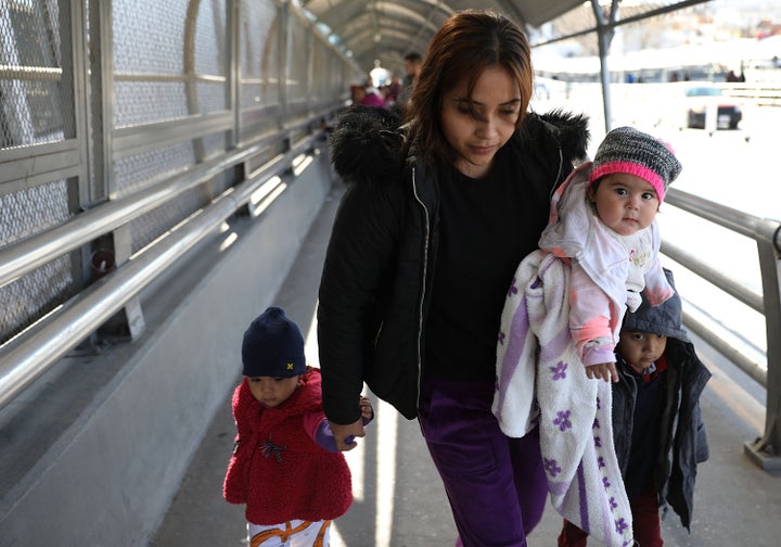 Daniela Serrano and her baby, Maria de Jesus Cabrera, from Michoacan, Mexico cross the Paso Del Norte Port of Entry bridge to turn themselves in to the U.S. Customs and Border Protection personnel for asylum consideration on January 13, 2019 in Ciudad Juarez, Mexico. 