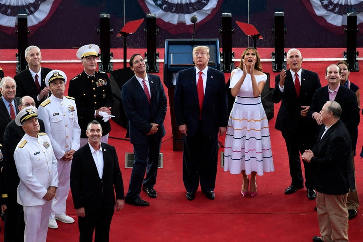 President Donald Trump, standing with first lady Melania Trump, Vice President Mike Pence and acting Defense Secretary Mark Esper, watches as the U.S. Navy Blue Angels fly over during a July Fourth celebration.