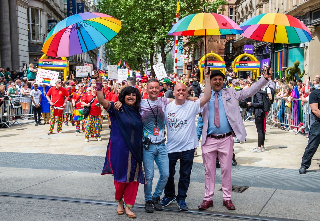 Andrew Moffat, pioneer of the inclusive No Outsiders programme, walks arm in arm with LGBTQ Muslim campaigners Saima Razzaq and Khakan Qureshi and Birmingham Pride director Lawrence Barton during Birmingham's parade in May.