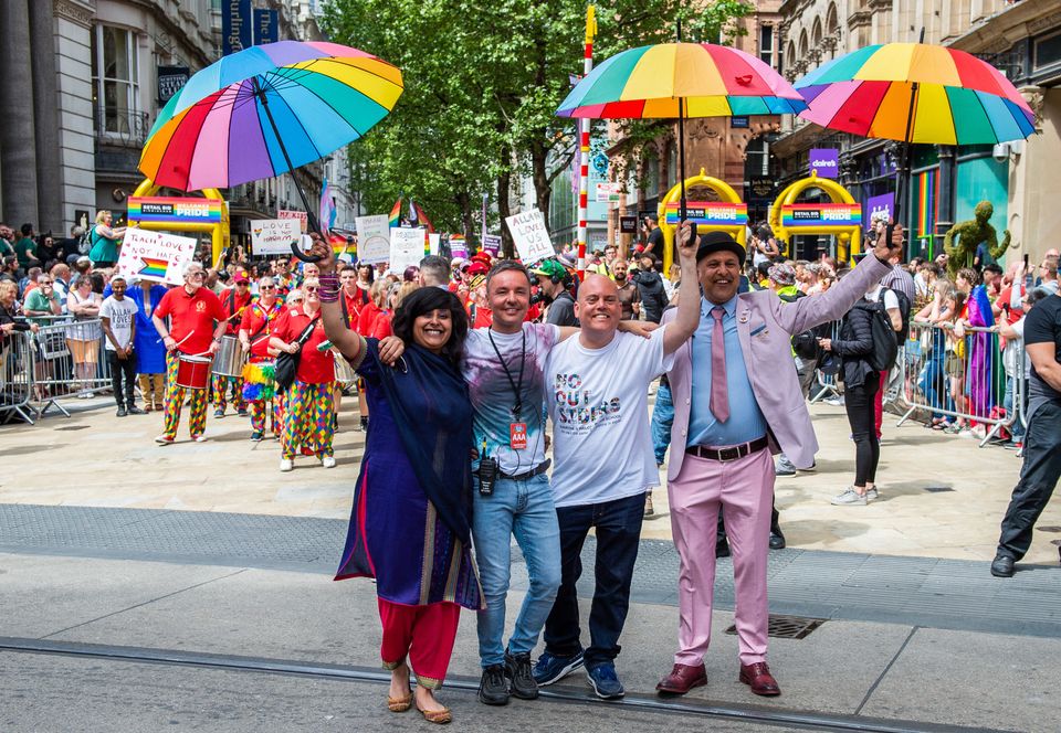 Andrew Moffat, pioneer of the inclusive No Outsiders programme, walks arm in arm with LGBTQ Muslim campaigners Saima Razzaq and Khakan Qureshi and Birmingham Pride director Lawrence Barton during Birmingham's parade in May.