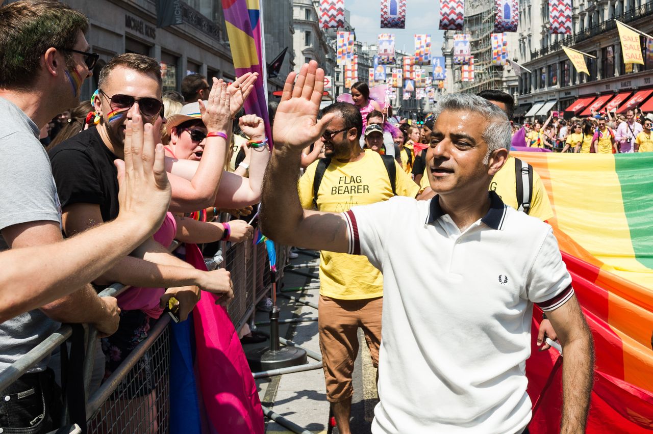 Mayor of London Sadiq Khan high-fives revellers lining Regents Street during Pride in London parade last year.