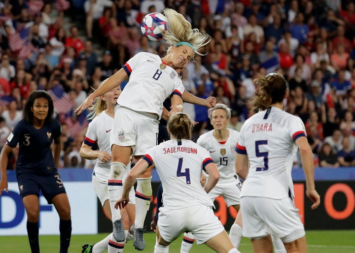 Julie Ertz, a midfielder on the U.S. women's national team, heads the ball in the match against France. The U.S. won that game 2-1.