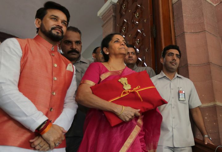 Finance Minister Nirmala Sitharaman (Centre) pictured with the budget document. 