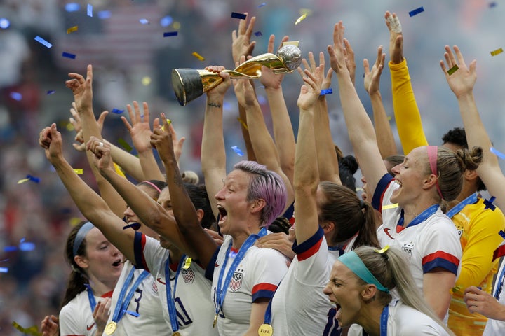 Rapinoe holds the trophy after winning the Women's World Cup final soccer match against the Netherlands.