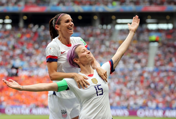 Megan Rapinoe (right) celebrates after scoring the opening goal from the penalty spot during the Women's World Cup final soccer match in France.