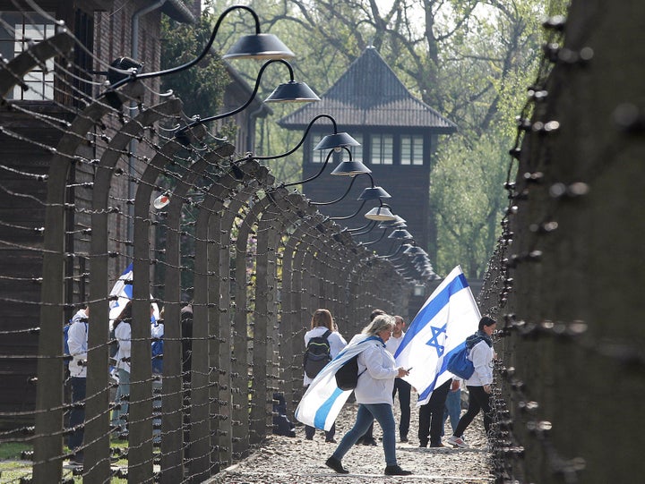 Participants in the Jewish event of Holocaust remembrance walk in the former Nazi World War II death camp of Auschwitz in Osw