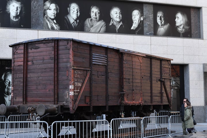 Portraits of Holocaust survivors are displayed in April 2019 at New York's Museum of Jewish Heritage, as a vintage German tra