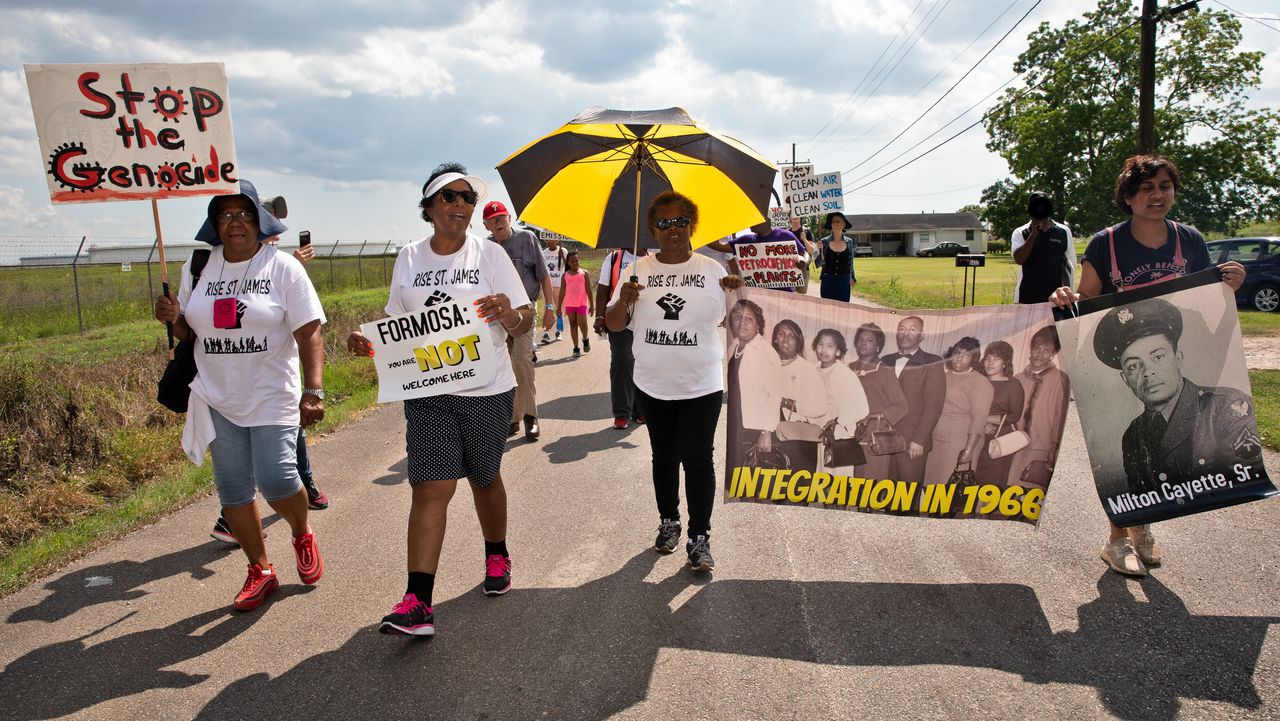 Sharon Lavigne on Burton Lane in St. James Louisiana, holding an anti-Formosa sign on the second day of a march through Louisiana's 'Cancer Alley' held by the Coalition Against Death Alley on May 31, 2019.