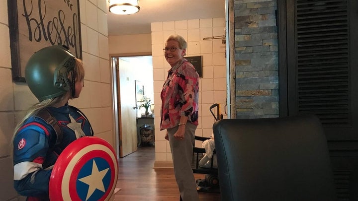 A young girl who lives in a Broyhill cottage talks to Linda Morgan, director of residential services at the North Carolina ho