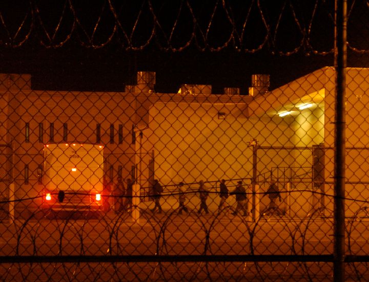 Migrants are loaded onto a bus early in the morning in 2006 at the Val Verde Correctional Facility in Del Rio, Texas. The migrant inmates were being taken to a courthouse to face criminal immigration charges.