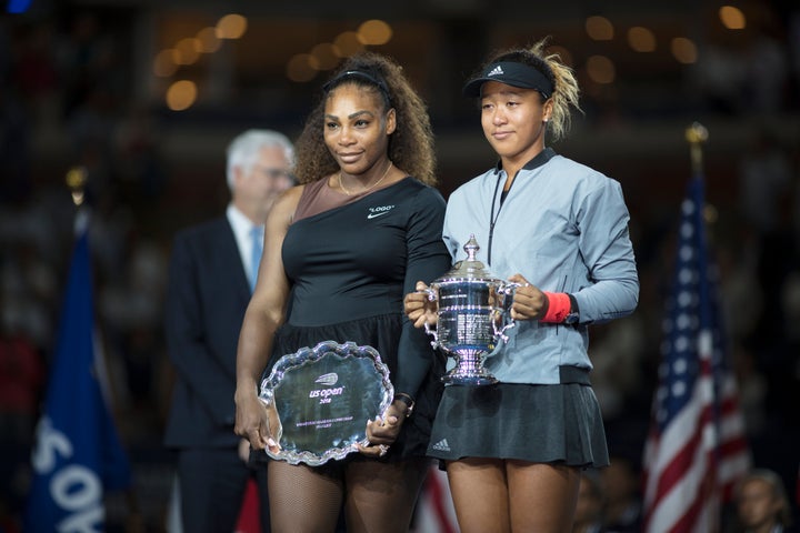 Osaka holds winner's trophy, Williams the runner-up award after their face-off last September.