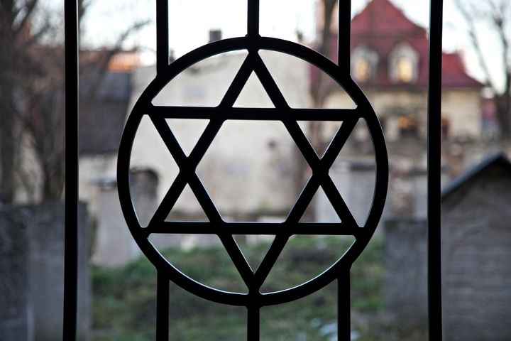 A high school principal in Florida who defended Holocaust deniers to a parent when asked about his school's Holocaust curriculum has been removed from his position. A Jewish cemetery in Krakow, Poland, is seen.