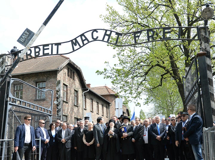 Politicians leading the Holocaust remembrance "March of the Living" for the six million for Holocaust victims walk through the "Arbeit Macht Frei" gate at the former Nazi German death camp of Auschwitz-Birkenau in Poland in May.