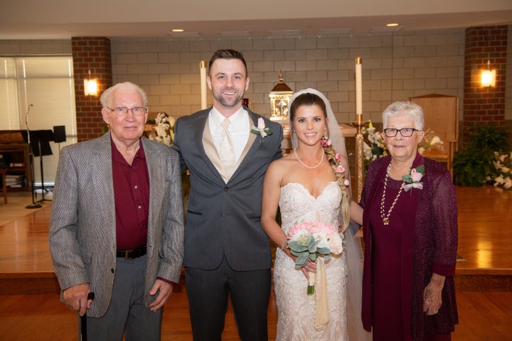 The newlyweds posing with Kleman's grandparents.